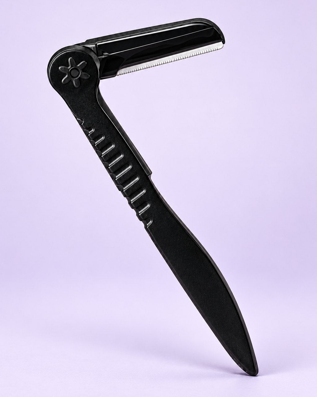 Black folding brow razor shown open