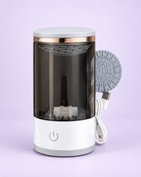 Electric makeup brush cleaner with a smoke tinted jar and white base