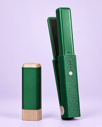 Green cordless mini flat iron with its cap
