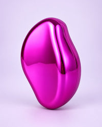 Rose crystal hair eraser showing its glossy, curved back