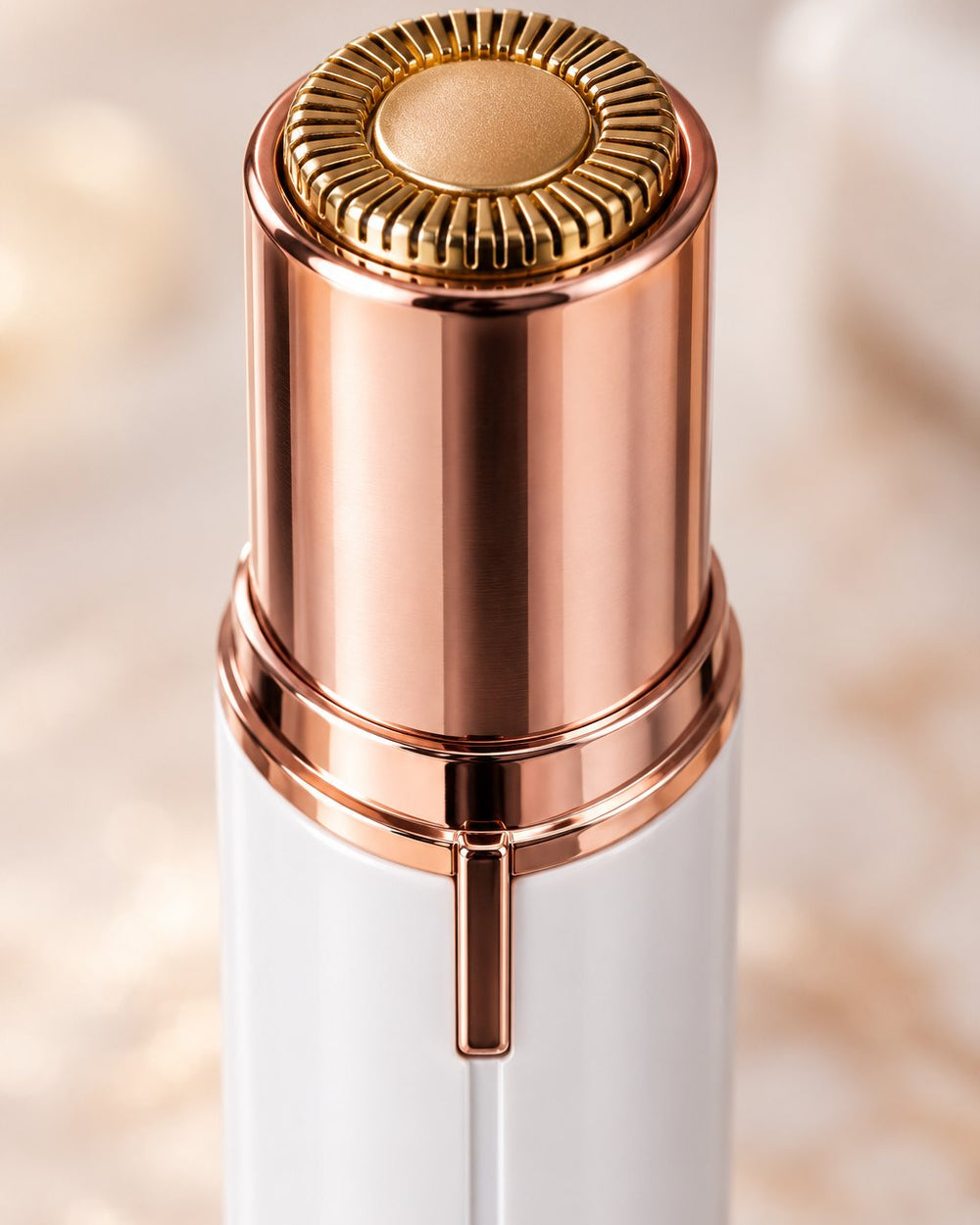 Close-up of the round gold-tone head with its slotted guard
