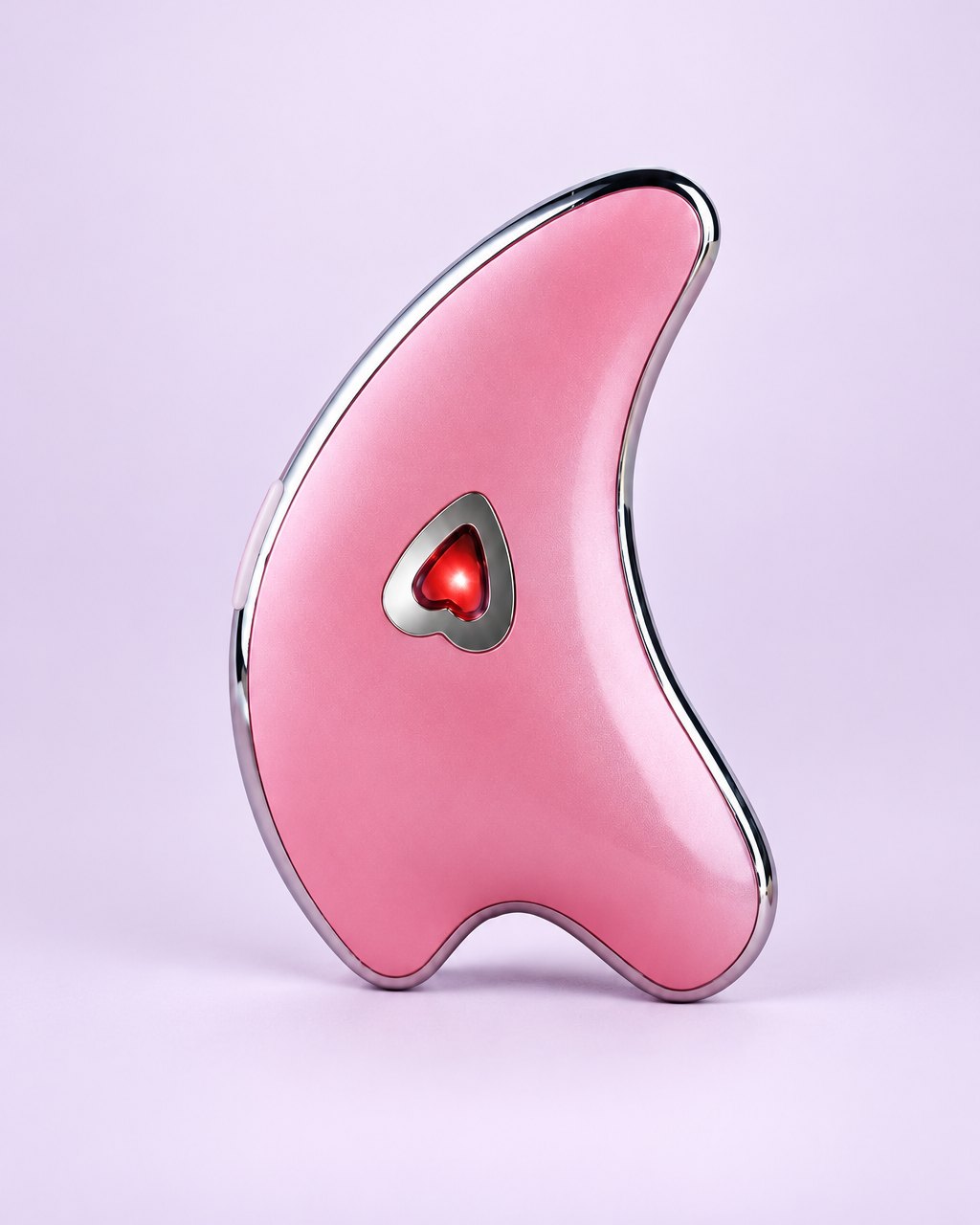Pink dolphin-shaped gua sha with a heart light in the middle