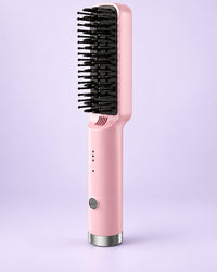 Pink heated straightening brush