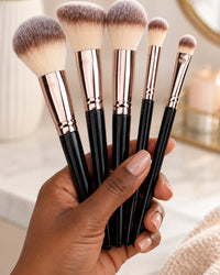 A handful of the brushes held in one hand