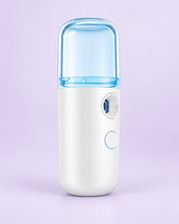 White nano facial mister with a blue-tinted cap
