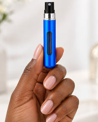 The slim atomizer held between two fingers