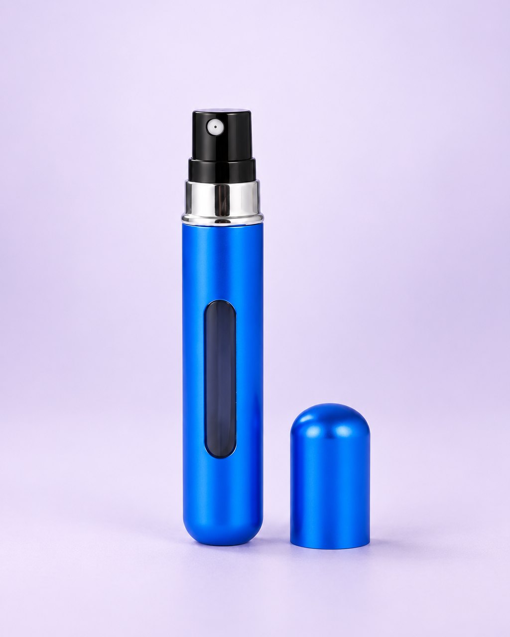 Matte blue refillable perfume atomizer with its cap beside it