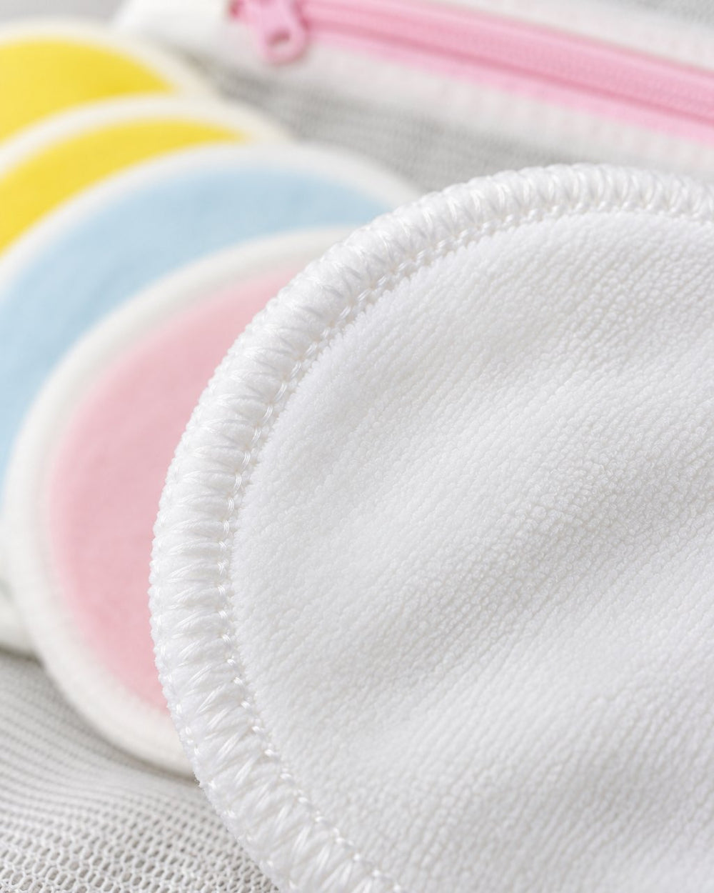 Close-up of a round's soft velvet surface and stitched edge