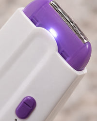 Close-up of the purple cutting head and the small light at its edge