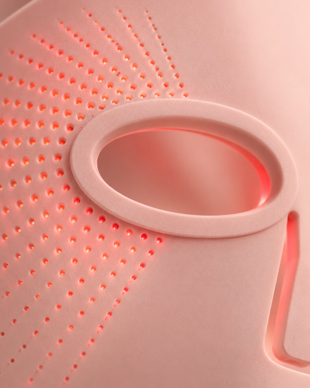 Close-up of the soft pink silicone and tiny LED dots beside an eye opening